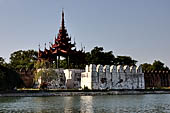 Myanmar - Mandalay, The Royal Palace, the walled enclosure with huge tiered roof tower.